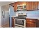 Updated kitchen features stainless steel appliances and a white subway tile backsplash at 3718 W Columbine Dr, Phoenix, AZ 85029