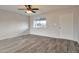 Bright living room features stylish tile flooring, a ceiling fan, and a large window for natural light at 3718 W Columbine Dr, Phoenix, AZ 85029