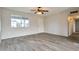 Cozy living room featuring tile flooring, a ceiling fan, a large window, and neutral paint for a modern look at 3718 W Columbine Dr, Phoenix, AZ 85029