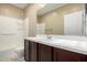 Bathroom featuring a single sink vanity, a shower-tub combo, and tile flooring at 41290 W Ganley Way, Maricopa, AZ 85138