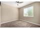 Bedroom with carpet, a ceiling fan and window with blinds provides a comfortable space at 41290 W Ganley Way, Maricopa, AZ 85138