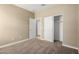 Bedroom with closet doors, and neutral carpet, for maximum flexibility at 41290 W Ganley Way, Maricopa, AZ 85138