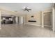 Open concept living space with kitchen, living room, and dining area, perfect for entertaining at 41290 W Ganley Way, Maricopa, AZ 85138