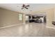 Open concept living space with kitchen, living room, and dining area, perfect for entertaining at 41290 W Ganley Way, Maricopa, AZ 85138