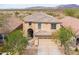 Aerial view of a two-story home with desert landscaping and mountain views at 42410 N 46Th Ln, Phoenix, AZ 85086