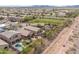 Aerial view of the community showing numerous homes with pools and desert landscaping at 42410 N 46Th Ln, Phoenix, AZ 85086