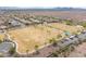 High-angle view of well-maintained sports fields and recreational areas in a residential community at 42410 N 46Th Ln, Phoenix, AZ 85086