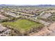 Neighborhood view showing houses, green spaces, and community amenities in a desert community at 42410 N 46Th Ln, Phoenix, AZ 85086