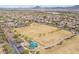Expansive aerial view of neighborhood homes adjacent to soccer fields and park amenities in a Gathering-friendly community at 42410 N 46Th Ln, Phoenix, AZ 85086