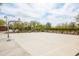 Outdoor basketball court in a community with mature landscaping, offering a recreational space for residents at 42410 N 46Th Ln, Phoenix, AZ 85086