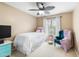 Well-lit bedroom with bed, side table, and accent chair for relaxation at 42410 N 46Th Ln, Phoenix, AZ 85086