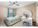 Comfortable bedroom with a bed, side table, and dresser at 42410 N 46Th Ln, Phoenix, AZ 85086