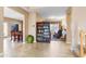 Inviting foyer showcases an open floor plan with tile floors, staircase, and seamless transition into the living spaces at 42410 N 46Th Ln, Phoenix, AZ 85086