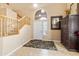 Warm and inviting foyer featuring tile flooring, staircase, and ample natural light at 42410 N 46Th Ln, Phoenix, AZ 85086