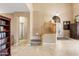 Grand foyer with high ceilings, staircase, and tile flooring sets a welcoming tone for this elegant home at 42410 N 46Th Ln, Phoenix, AZ 85086