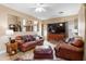 Spacious living room boasts a ceiling fan, large windows, comfortable seating, and seamless flow into the adjacent spaces at 42410 N 46Th Ln, Phoenix, AZ 85086