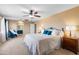 Serene main bedroom featuring a ceiling fan, ensuite bathroom and comfortable bed creating a relaxing retreat at 42410 N 46Th Ln, Phoenix, AZ 85086