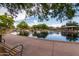 Peaceful park pond with water feature, picnic tables and mature landscaping at 42410 N 46Th Ln, Phoenix, AZ 85086