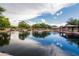 Calm pond reflecting the sky, surrounded by lush greenery and picnic areas at 42410 N 46Th Ln, Phoenix, AZ 85086