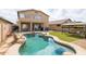 Backyard oasis featuring a private pool, manicured lawn, gazebo, and patio dining at 42410 N 46Th Ln, Phoenix, AZ 85086