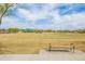 Scenic view of a grassy sports field with soccer goals, set against a backdrop of a blue, partly cloudy sky at 42410 N 46Th Ln, Phoenix, AZ 85086