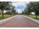 Scenic walking path lined with mature trees leading to a gazebo in the park at 42410 N 46Th Ln, Phoenix, AZ 85086