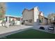 Spacious backyard featuring a patio, artificial grass and shade structure at 4670 W Linda Ln, Chandler, AZ 85226