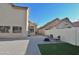 Spacious backyard with pavers, artificial turf, and seating area, ideal for entertaining at 4670 W Linda Ln, Chandler, AZ 85226