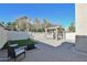 Inviting backyard with brick pavers, built-in fire pit, and covered patio at 4670 W Linda Ln, Chandler, AZ 85226