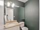 Bathroom with granite countertop, globe vanity lights, and large wall mirror at 4670 W Linda Ln, Chandler, AZ 85226