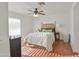 Bedroom features hardwood floors, ceiling fan, and white walls at 4670 W Linda Ln, Chandler, AZ 85226