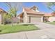 Beautiful single-Gathering home featuring manicured lawn, mature tree, and convenient two-car garage at 4670 W Linda Ln, Chandler, AZ 85226