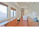 Loft area featuring built-in desk, wood floors, and large window at 4670 W Linda Ln, Chandler, AZ 85226