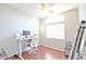 Bright home office with large window, desk and office chair at 4670 W Linda Ln, Chandler, AZ 85226