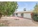 A landscaped backyard is adjacent to the house and features seating and lots of shade at 5038 E Morning Star Dr, Phoenix, AZ 85044