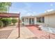 Charming backyard featuring a covered patio, low maintenance landscaping, and seating at 5038 E Morning Star Dr, Phoenix, AZ 85044