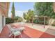 Backyard with patio area, relaxing seating and lush landscaping offer an outdoor oasis at 5038 E Morning Star Dr, Phoenix, AZ 85044