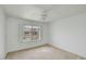 Bedroom featuring a ceiling fan, window and carpet at 5038 E Morning Star Dr, Phoenix, AZ 85044