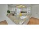 Modern kitchen featuring granite countertops, white cabinets, and updated appliances at 5038 E Morning Star Dr, Phoenix, AZ 85044