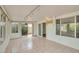 A sun room features tiled floors, recessed lights, and many windows at 5038 E Morning Star Dr, Phoenix, AZ 85044