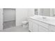 Clean bathroom featuring white cabinets, a toilet, a closet, and a well-lit vanity mirror at 5818 W Sunrise Dr, Laveen, AZ 85339