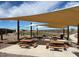 Covered picnic area in the community featuring multiple tables and seating under a shaded canopy at 5818 W Sunrise Dr, Laveen, AZ 85339