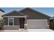 Charming single-story home with a two-car garage and stone accents, offering classic curb appeal at 5818 W Sunrise Dr, Laveen, AZ 85339