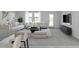 Modern living room with white sofas, contemporary decor, and a flat-screen TV for entertainment at 5818 W Sunrise Dr, Laveen, AZ 85339