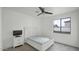Well-lit bedroom with a white bed frame, dresser, and a large window providing natural light at 6818 W St Catherine Ave, Laveen, AZ 85339