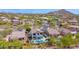 Stunning aerial view of a neighborhood with lush landscaping and mountain views at 7242 E Tyndall St, Mesa, AZ 85207