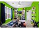 Vibrant bedroom with shelves, playful decor, a large window, and a colorful accent rug at 7242 E Tyndall St, Mesa, AZ 85207
