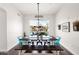 Beautiful dining room with a view of the pool area and features modern furnishings at 7242 E Tyndall St, Mesa, AZ 85207