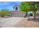 Charming two-story home with a three car garage, desert landscaping and mature shade trees at 7242 E Tyndall St, Mesa, AZ 85207
