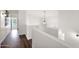 Bright hallway with clean lines, modern lighting, and neutral tones, creating a serene and open feel at 7242 E Tyndall St, Mesa, AZ 85207